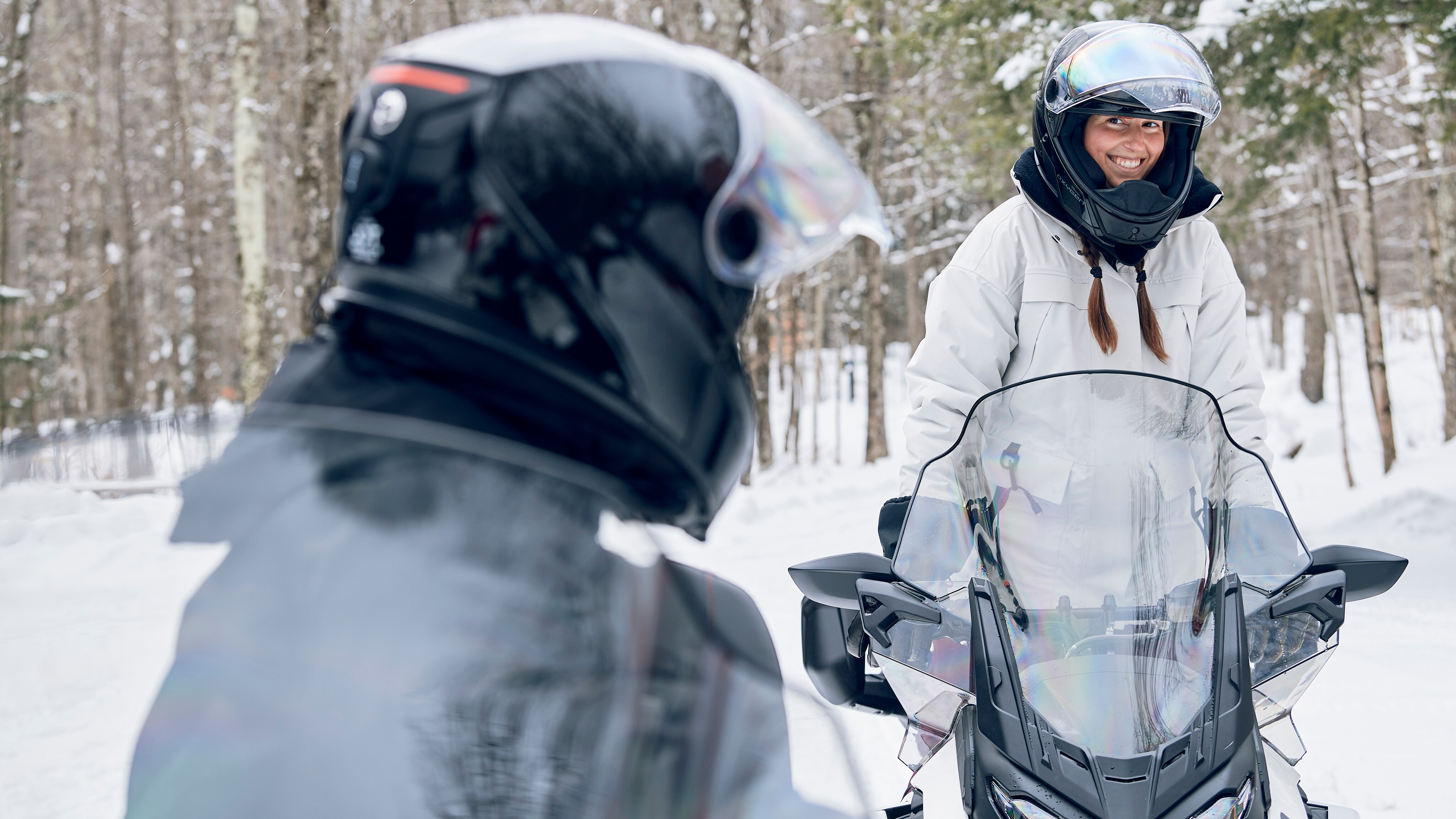 Two friends out on a ride with the 2024 Ski-Doo Grand Touring Electric