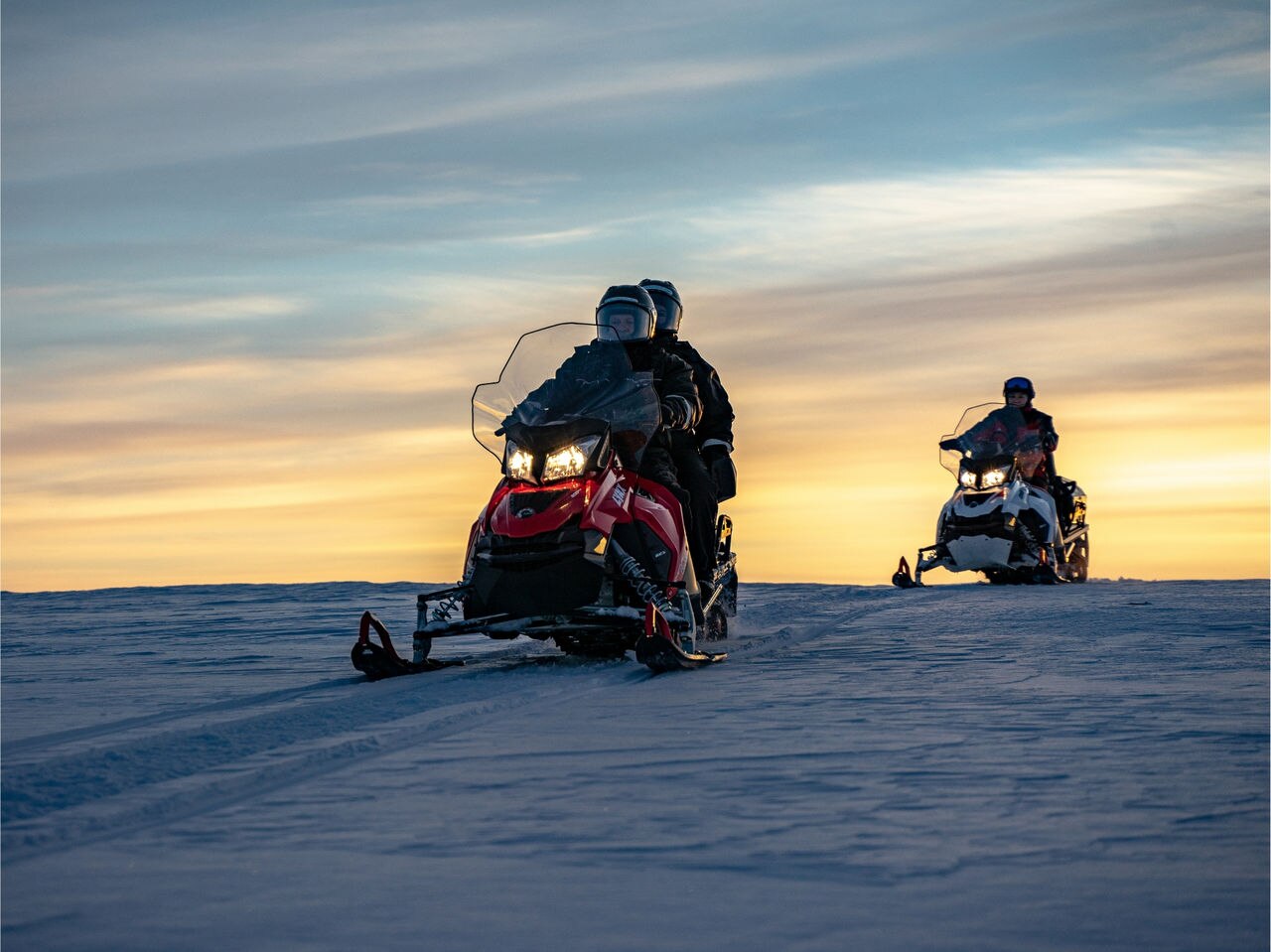 Ride a Lynx under the beautiful lit‑up skies of the Arctic