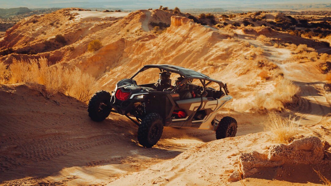 two Can-Am riders in the desert