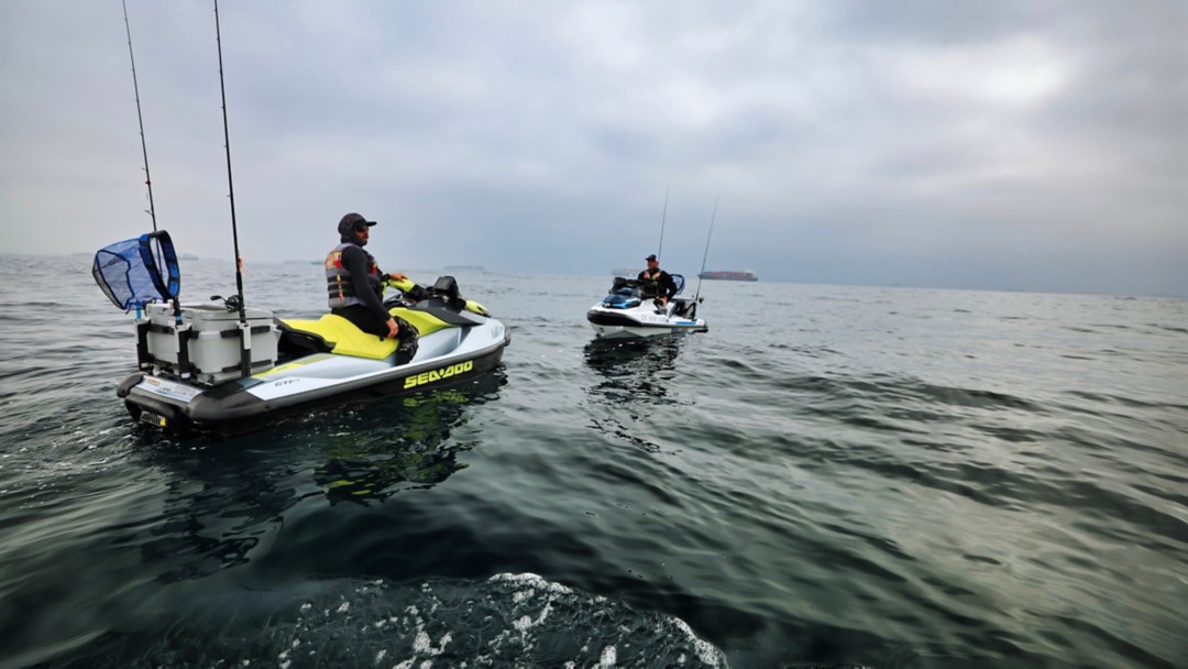 A man on Sea-Doo Fish Pro in the harbour 