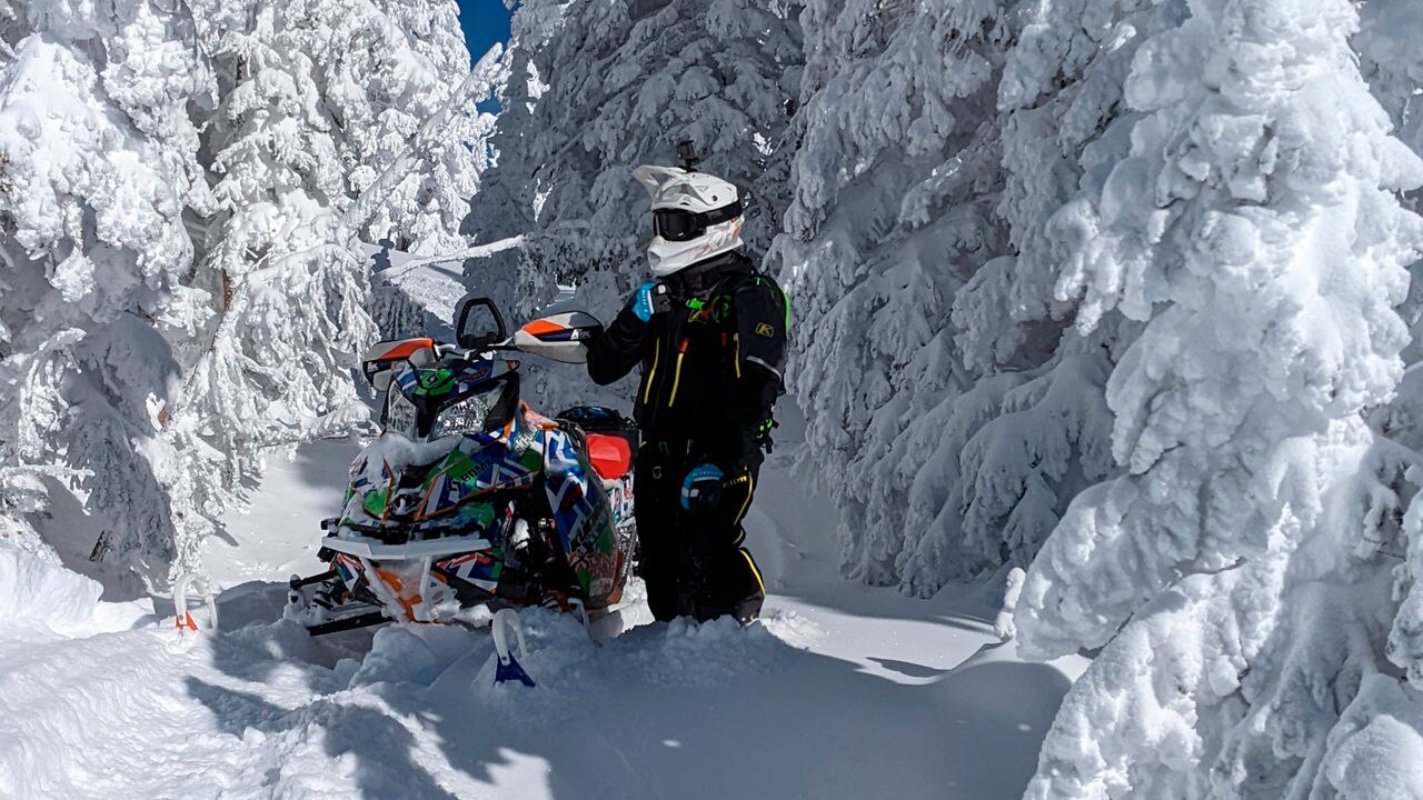 Ski-Doo rider in the forest
