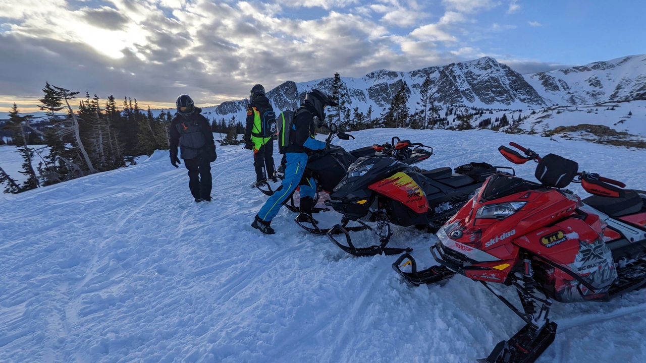 group of Ski-Doo riders in the mountains