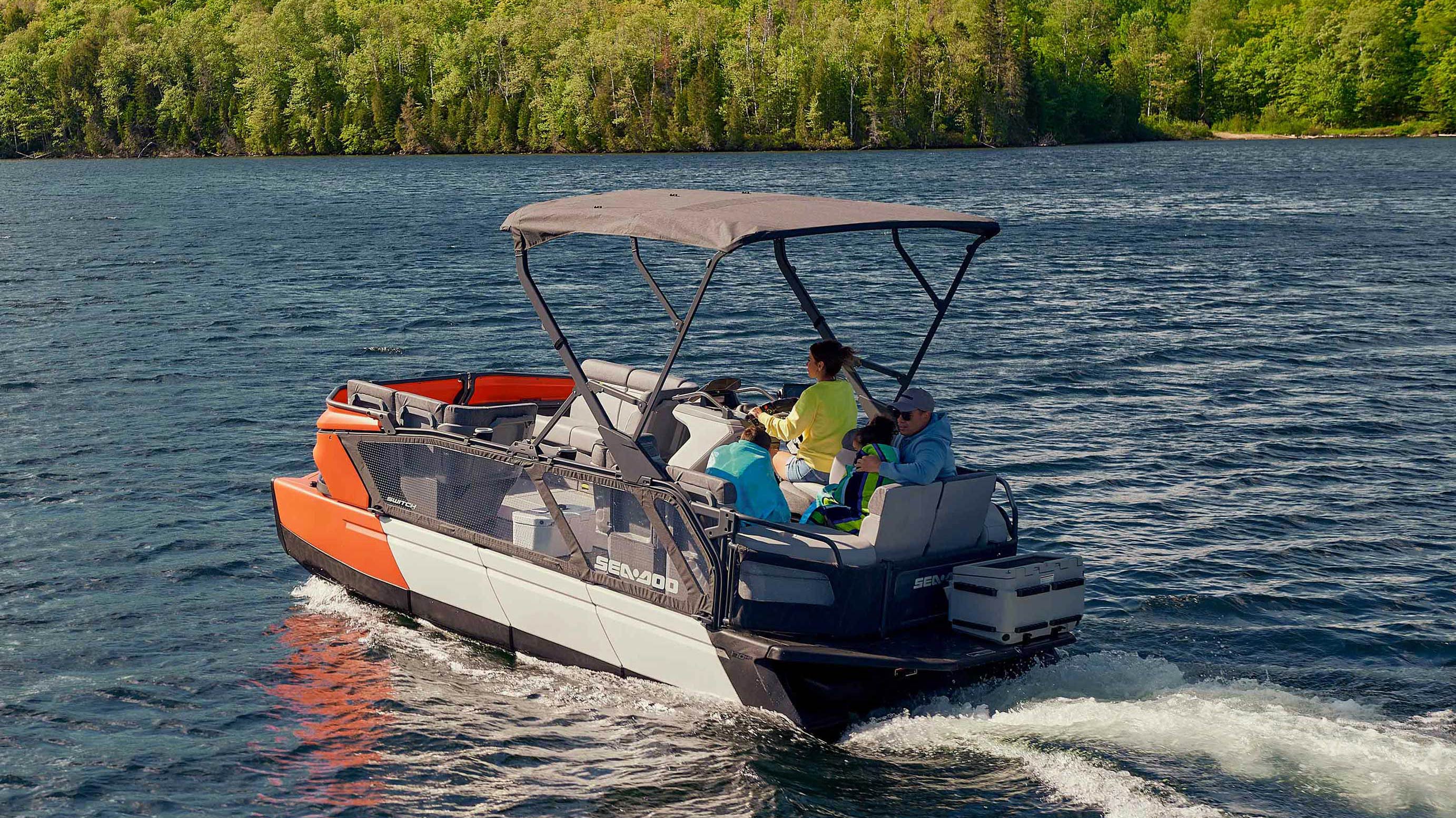 A couple driving a pontoon 