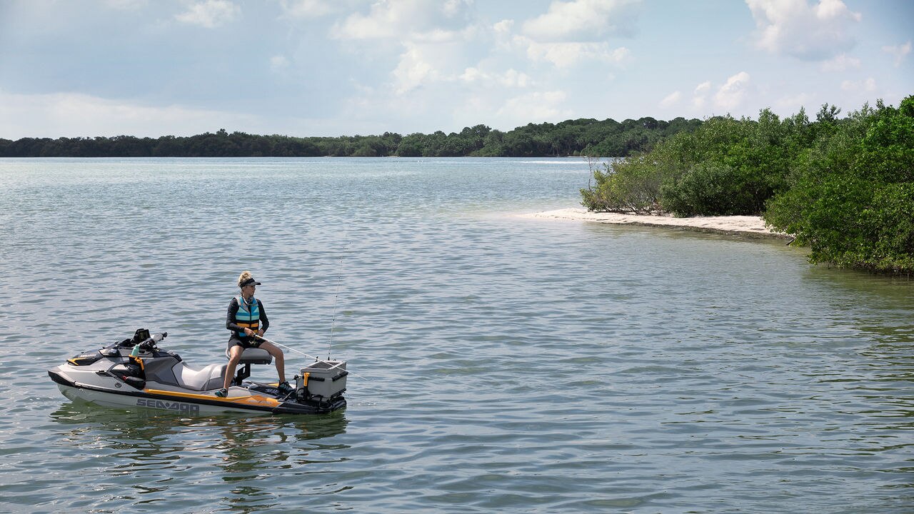 Woman fishing on a Sea-Doo PWC