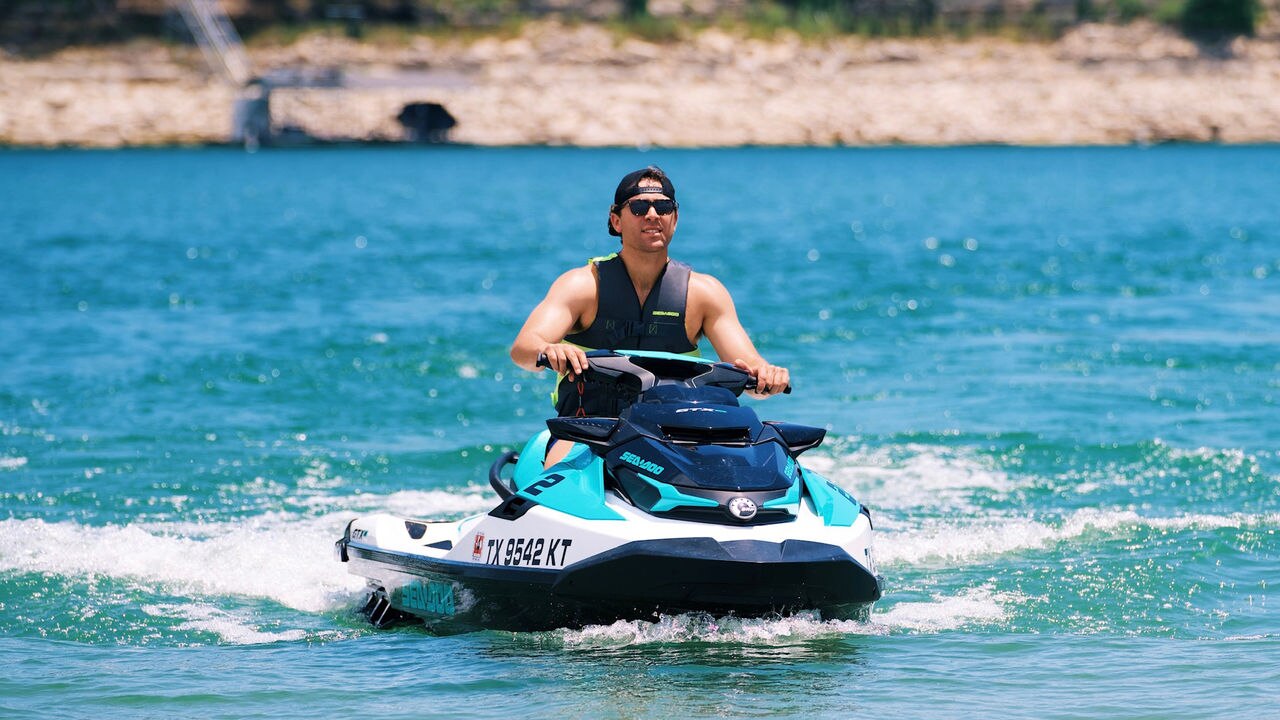 Men cruising on the water with a Sea-Doo PWC