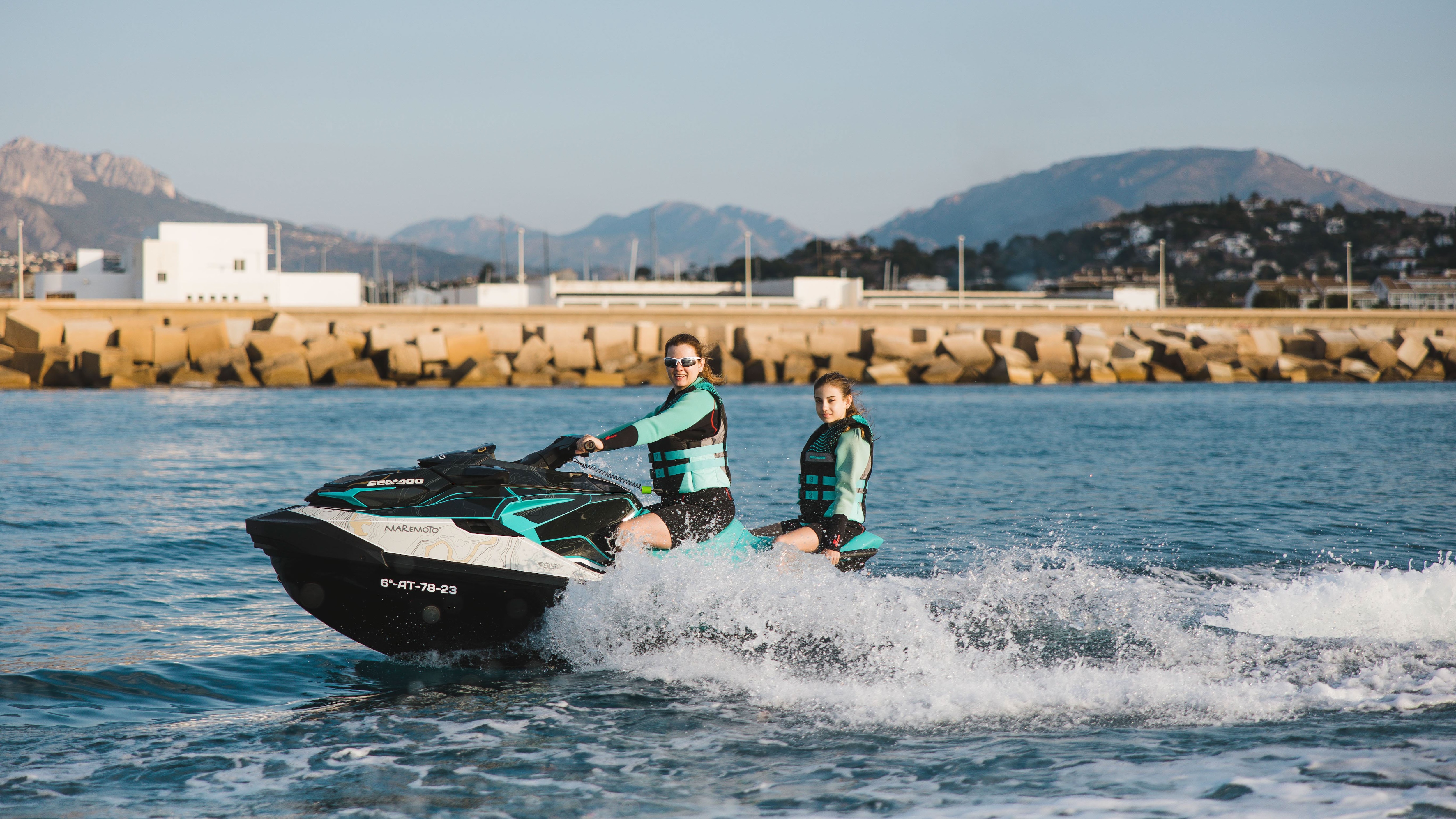 Mother & daughter riding a Sea-Doo personal watercraft