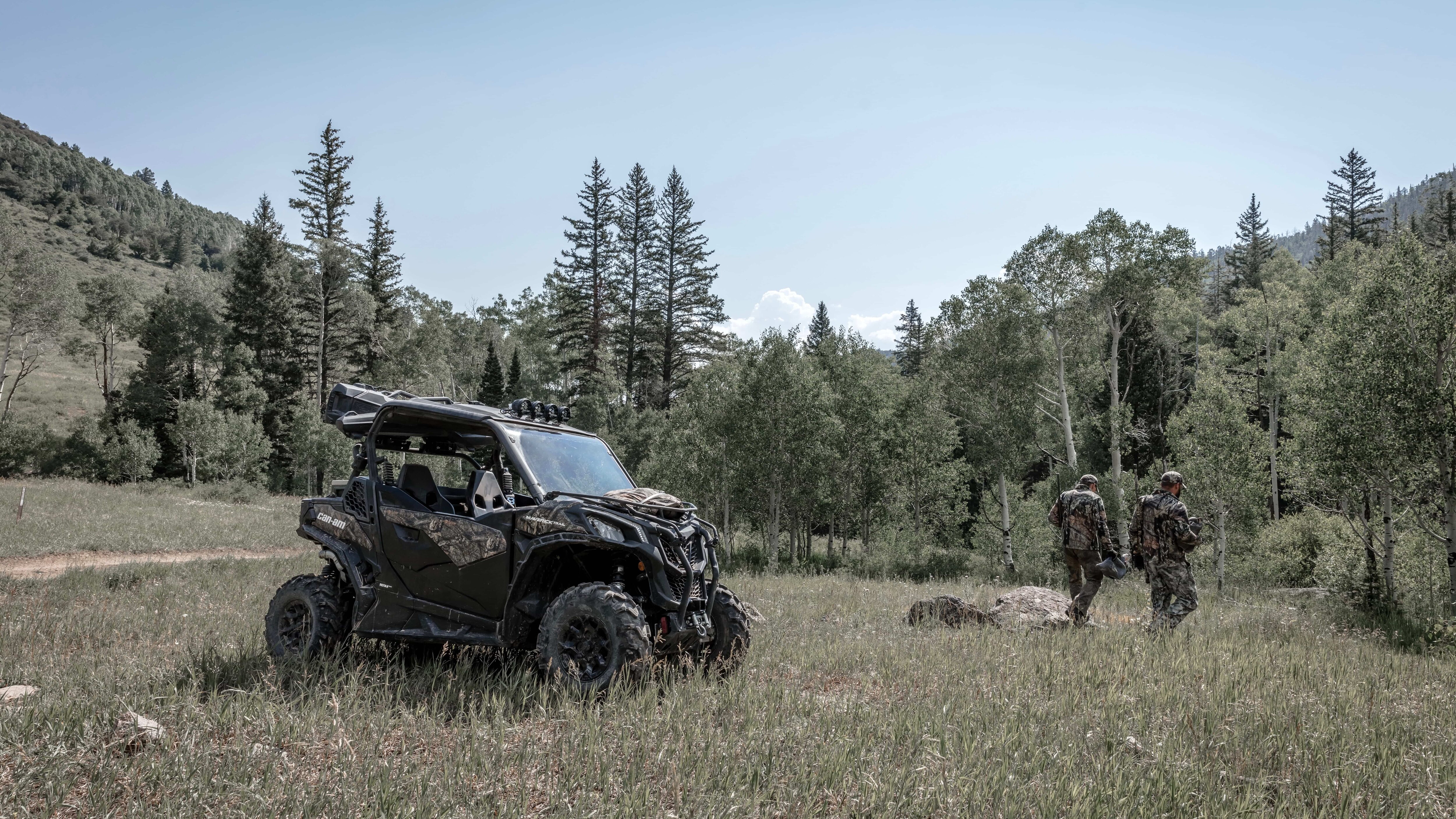 A Cam am UTV parked in the forest