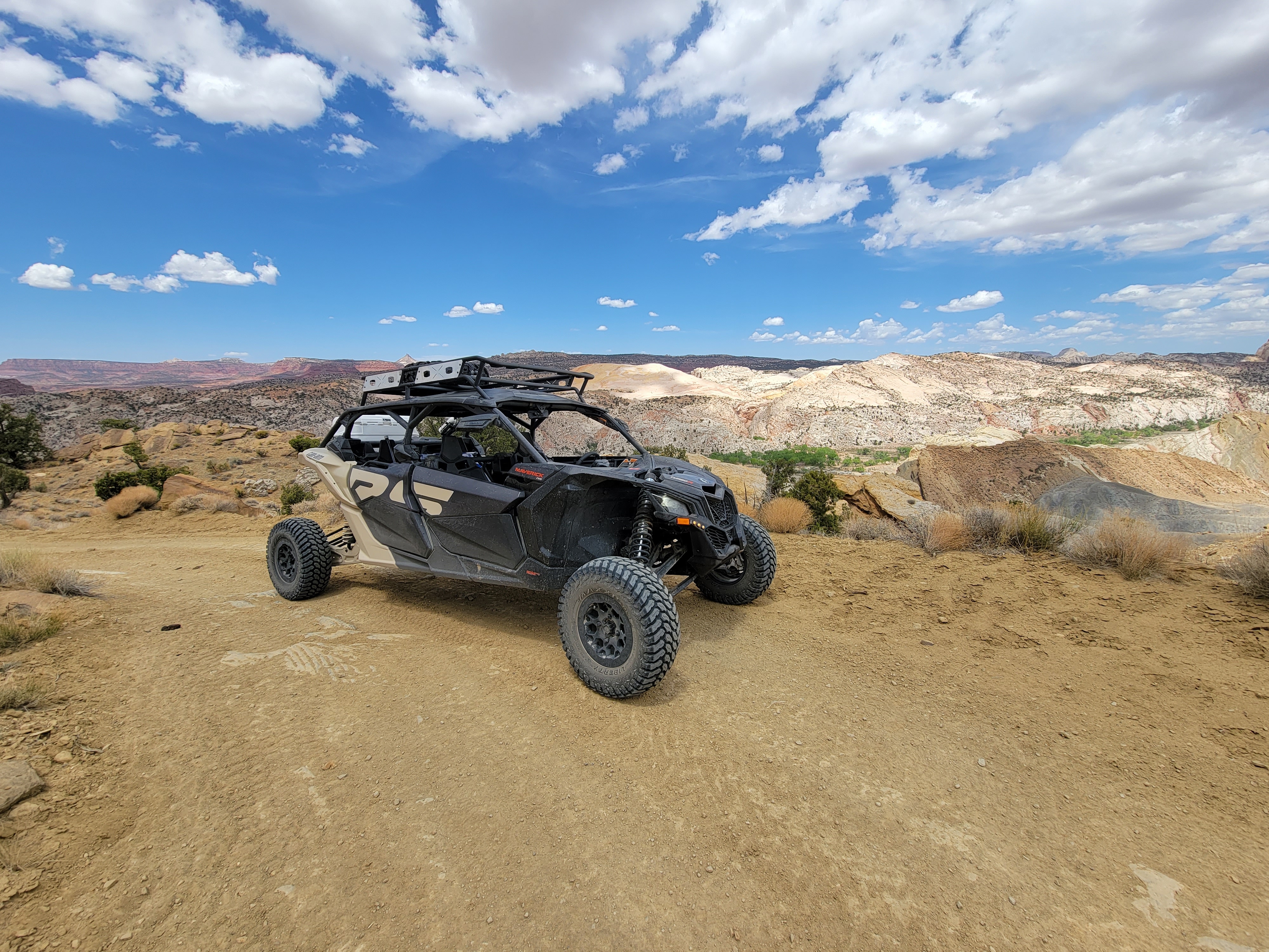 A Can-Am SxS parked on top of a canyon