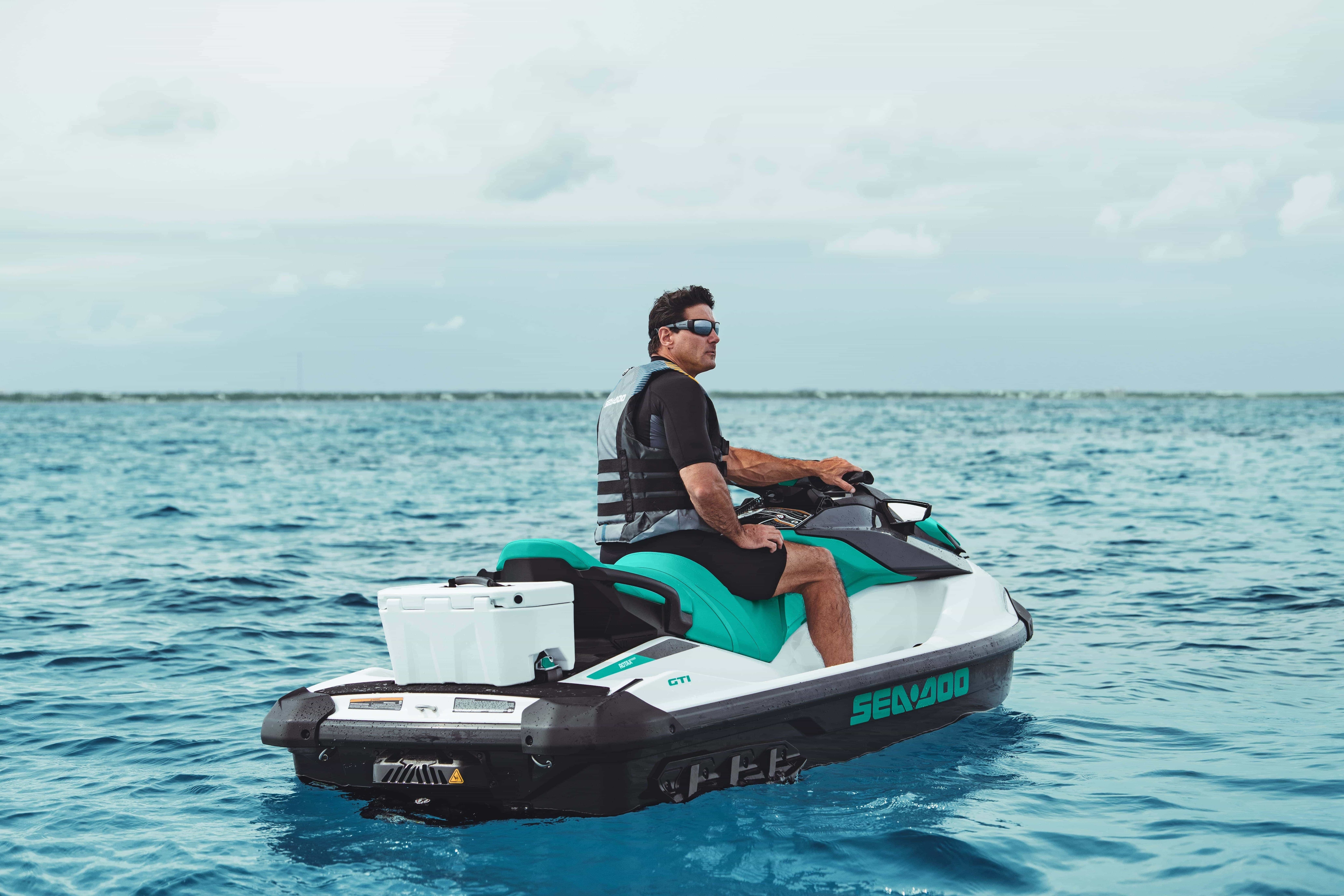 People riding watercrafts on the water