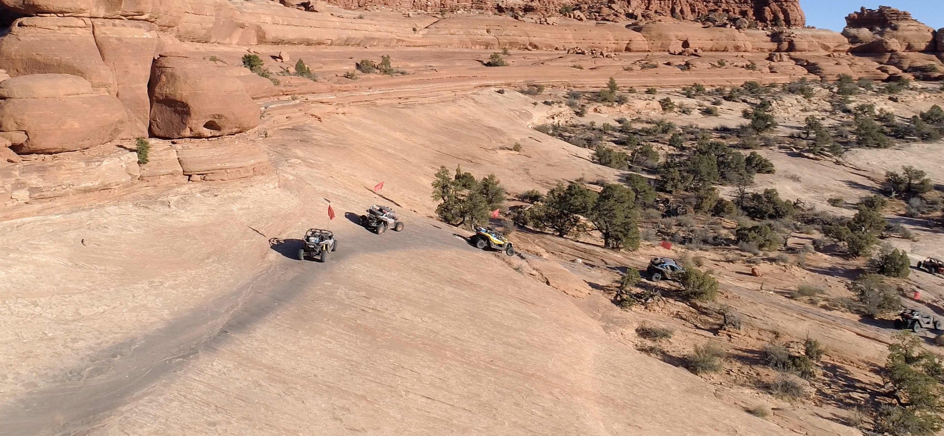 Maverick X3 riding in desert with canyons