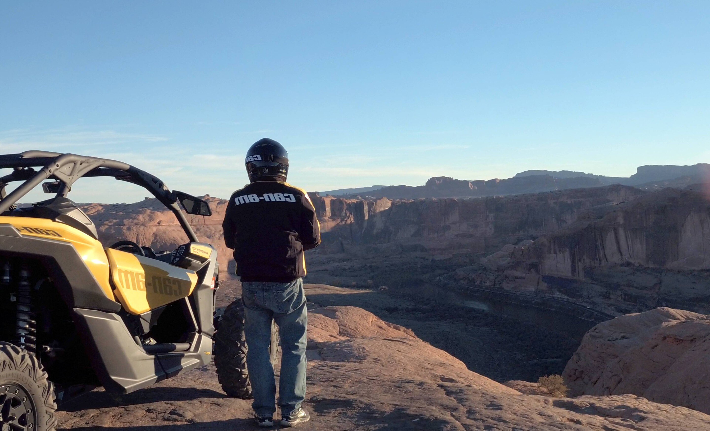 Men beside Maverick X3 at the top