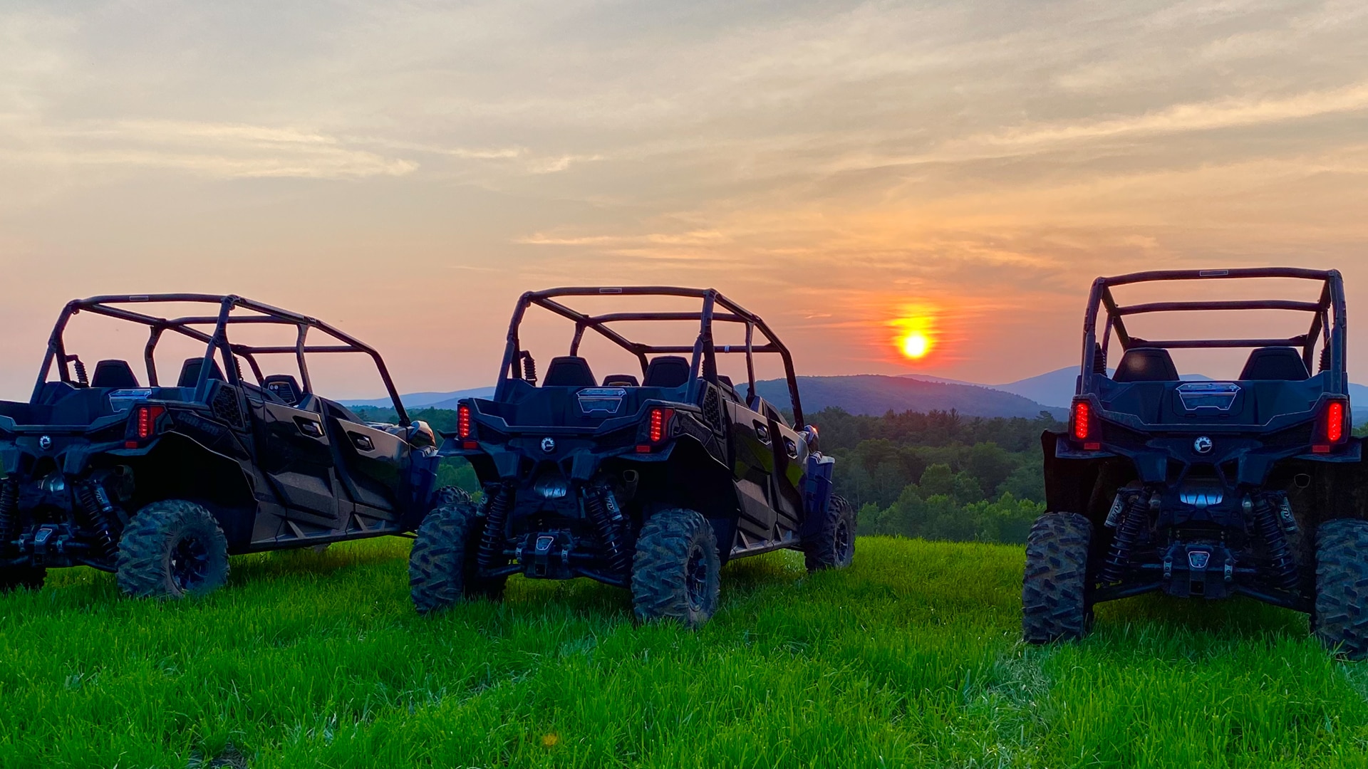 3 Can-Am units facing the sunset 