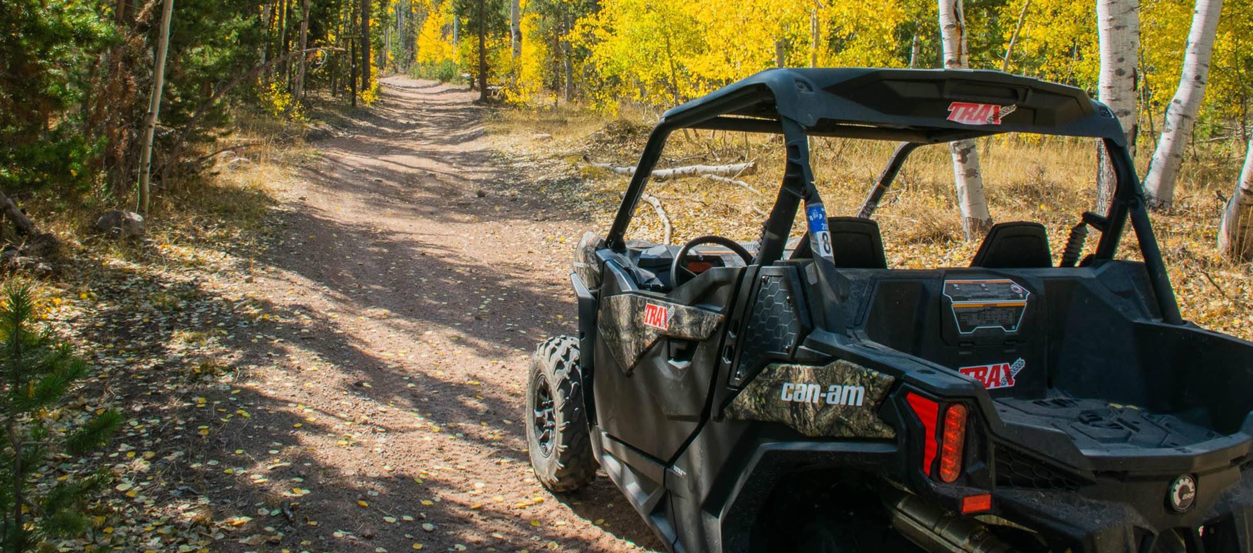 Can-Am vehicle on a trail in the forest