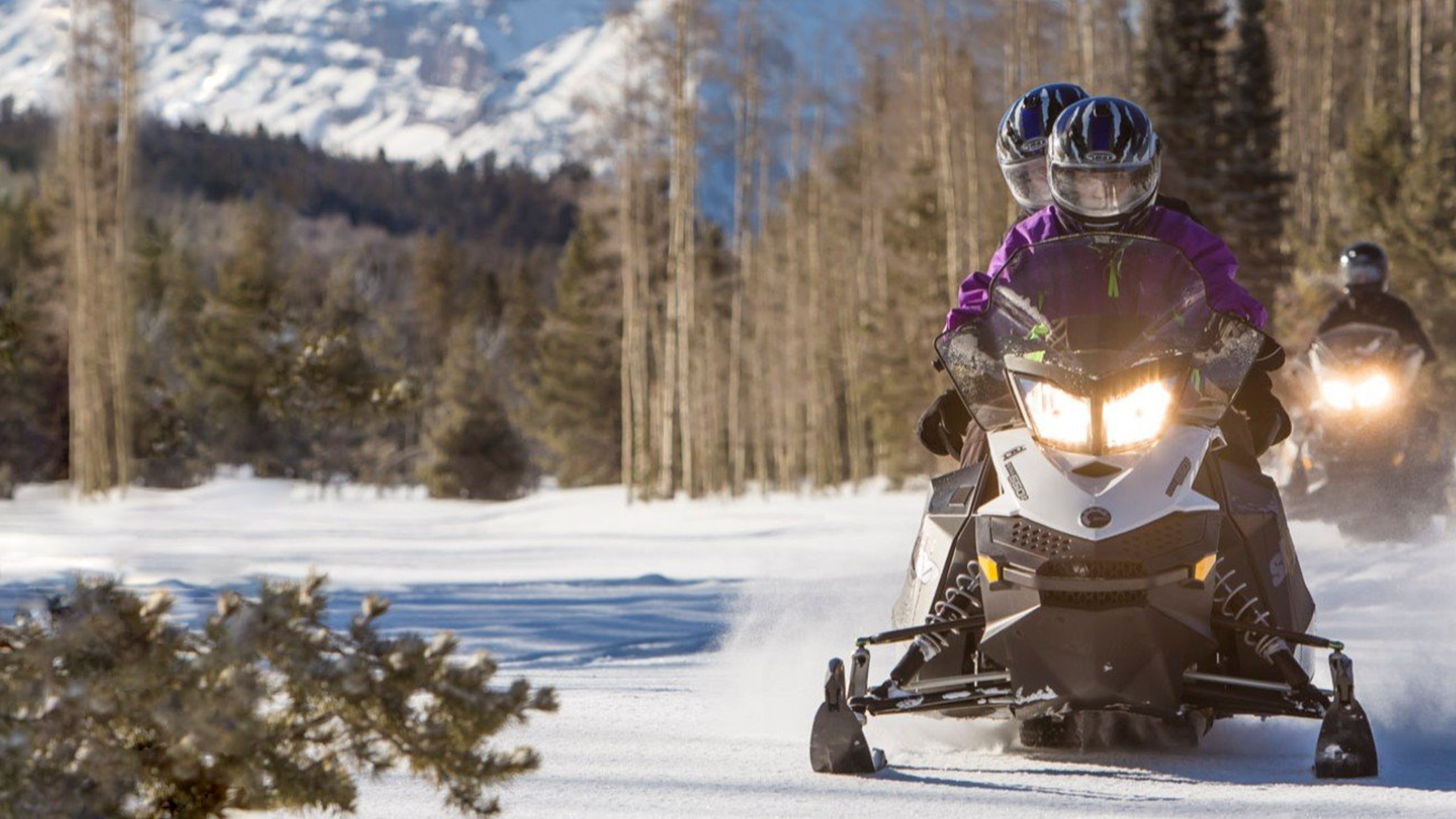 Front view of Ski-Doo riders driving