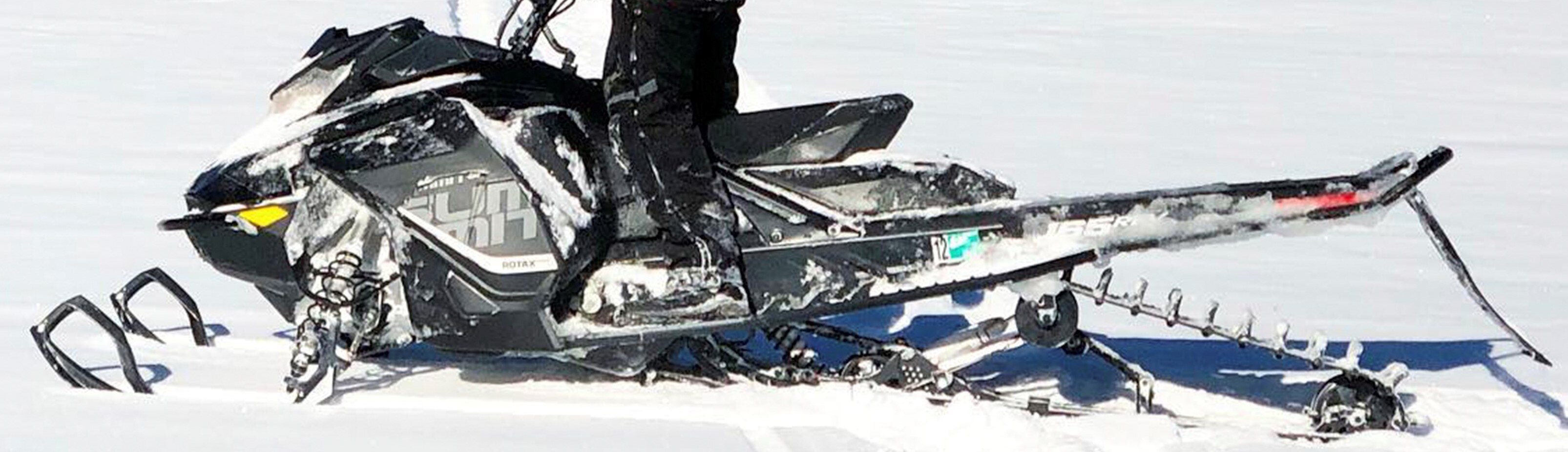 Ski-Doo rider looking at other riders