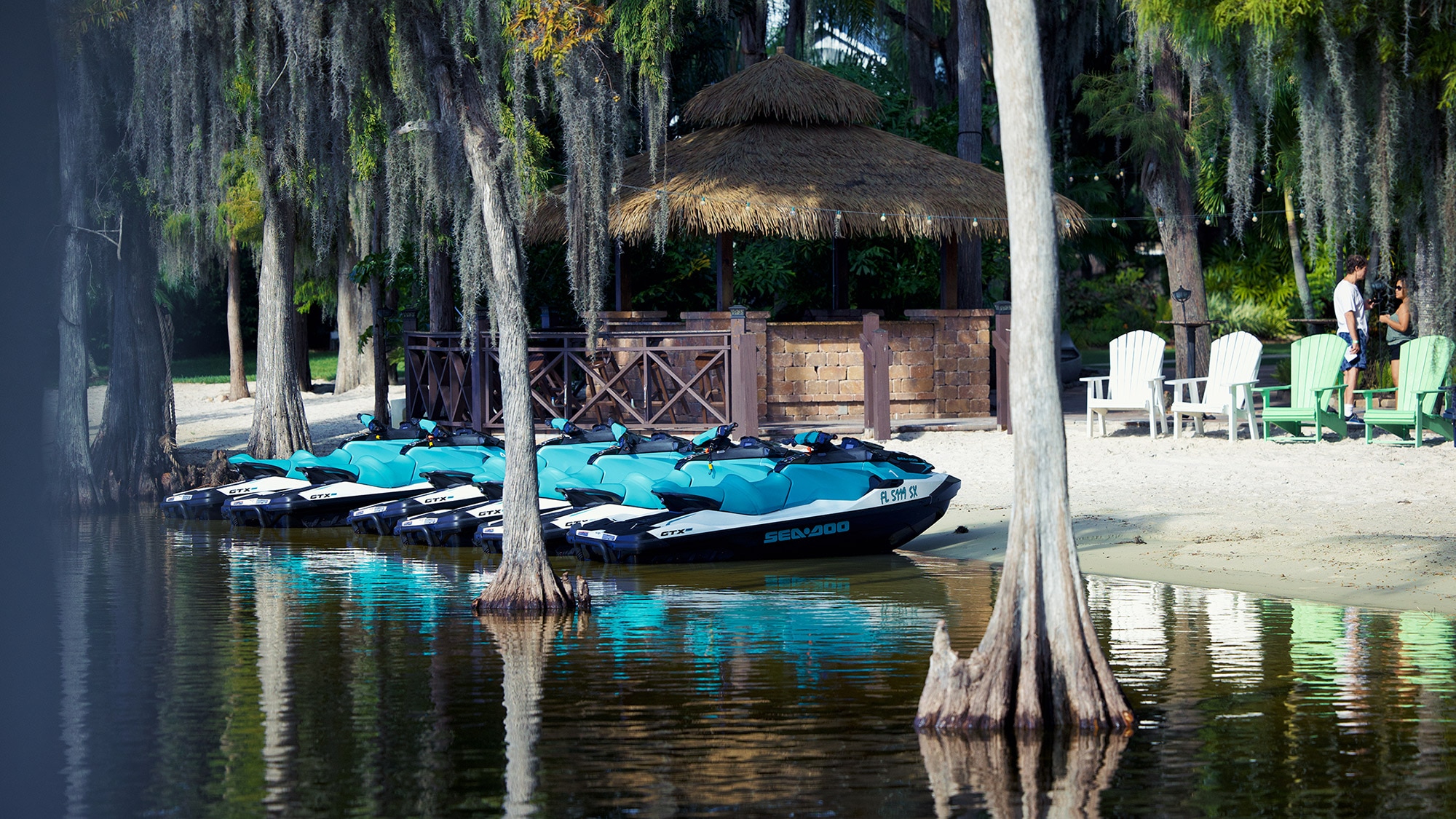 People riding personal watercraft