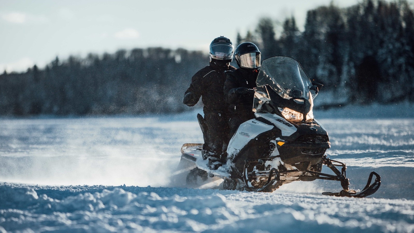 Two person riding on a Ski-Doo