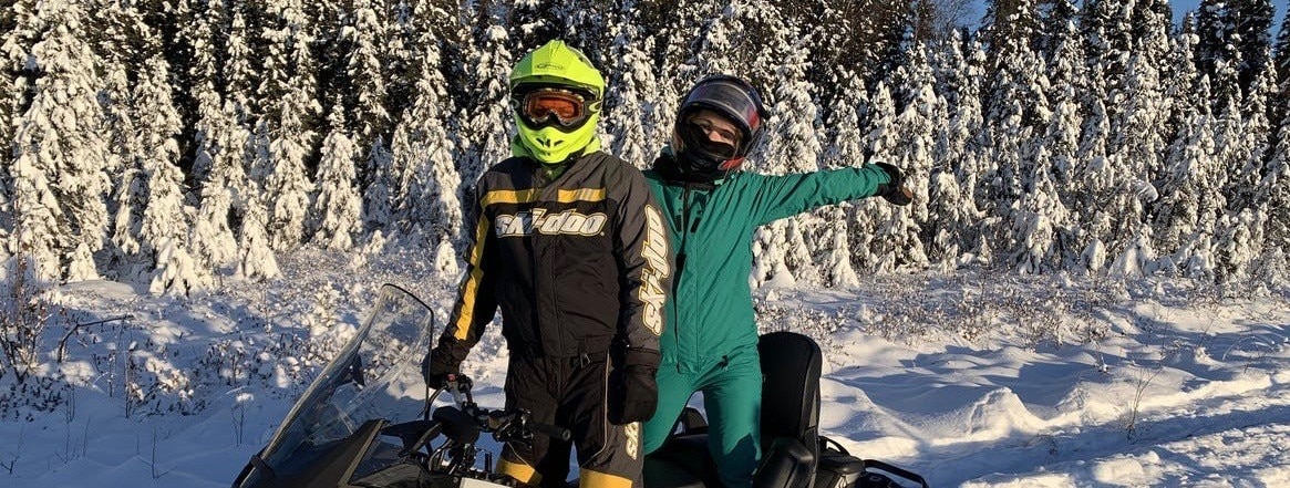 Two people happy on a Ski-Doo