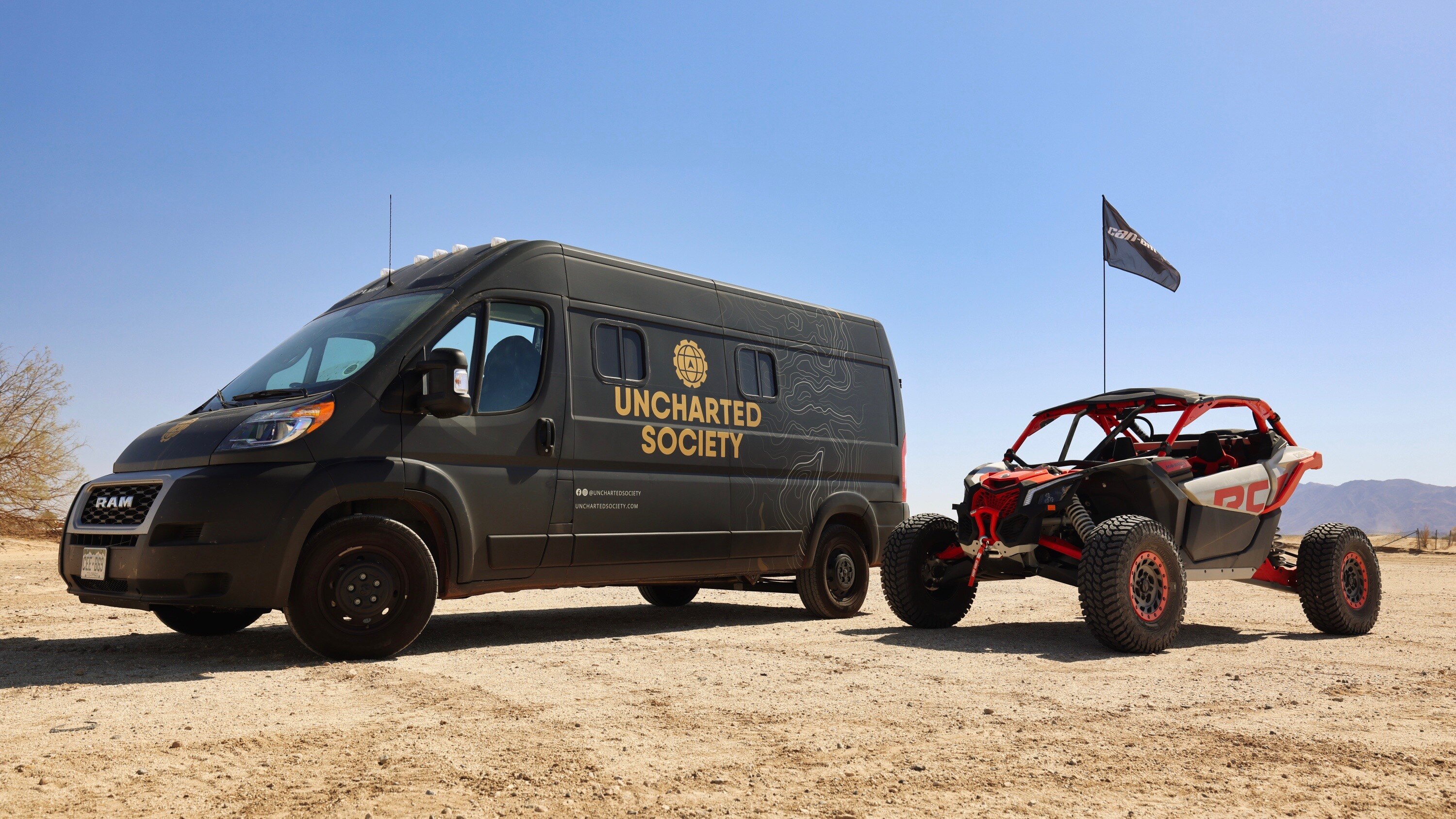 Van and Maverick parked in the desert