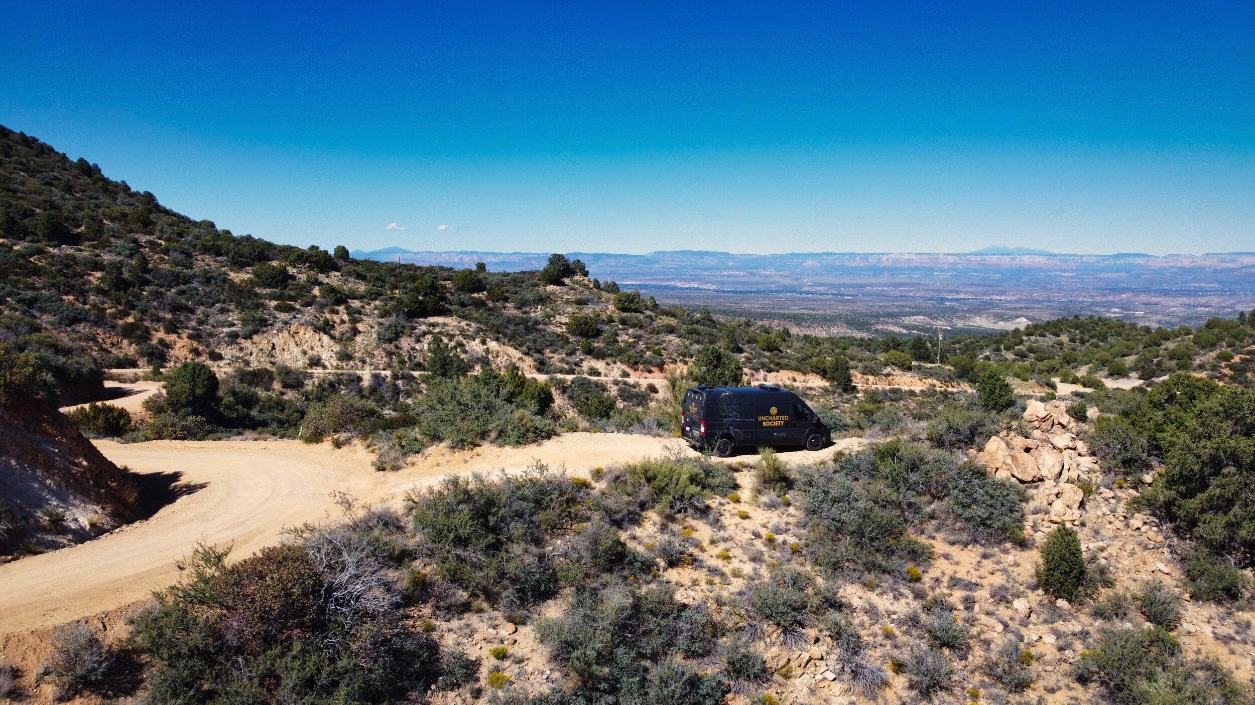 Birds Eye view of the mountains and a van