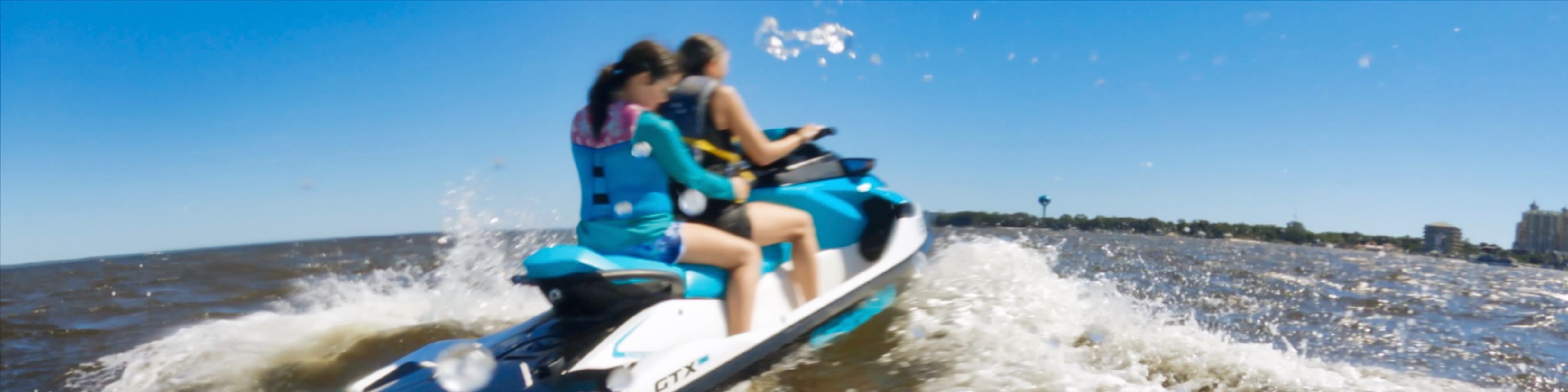 Two women riding a Sea-Doo