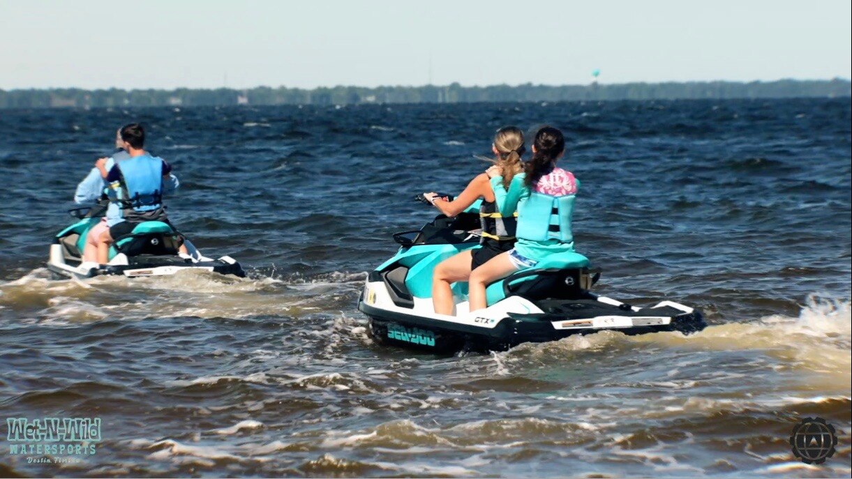 People coasting on a Sea-Doo