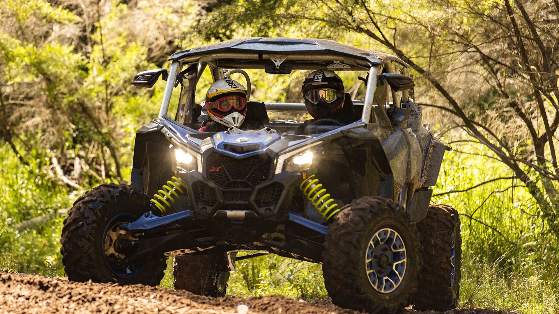 Two riders in a Can-Am Maverick
