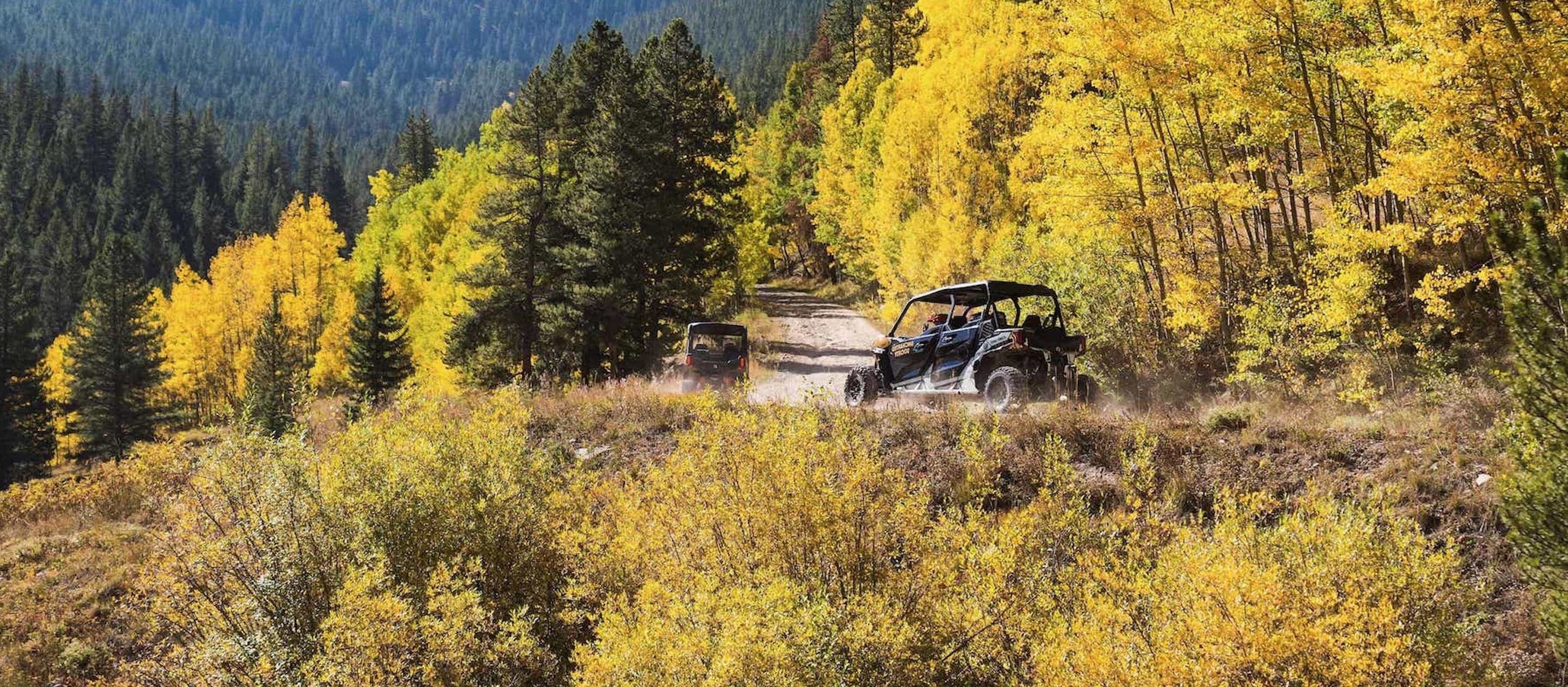 Two Can-am Maverick riding in a mountain trail in Colorado