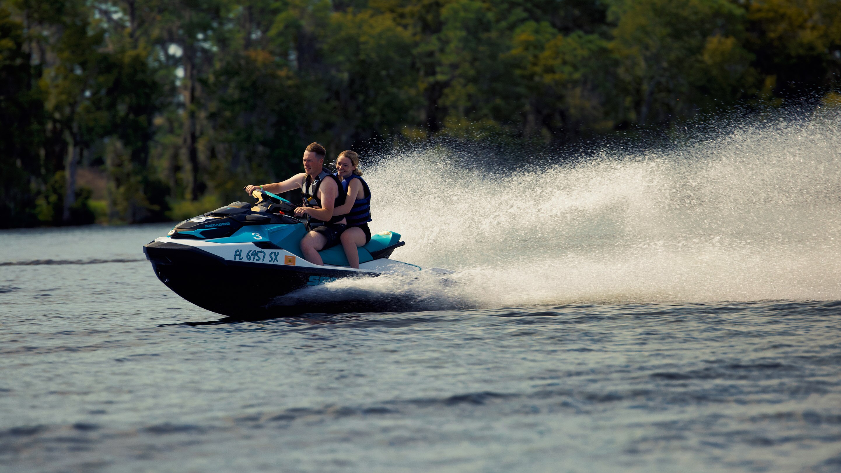 A couple riding on a Sea-Doo