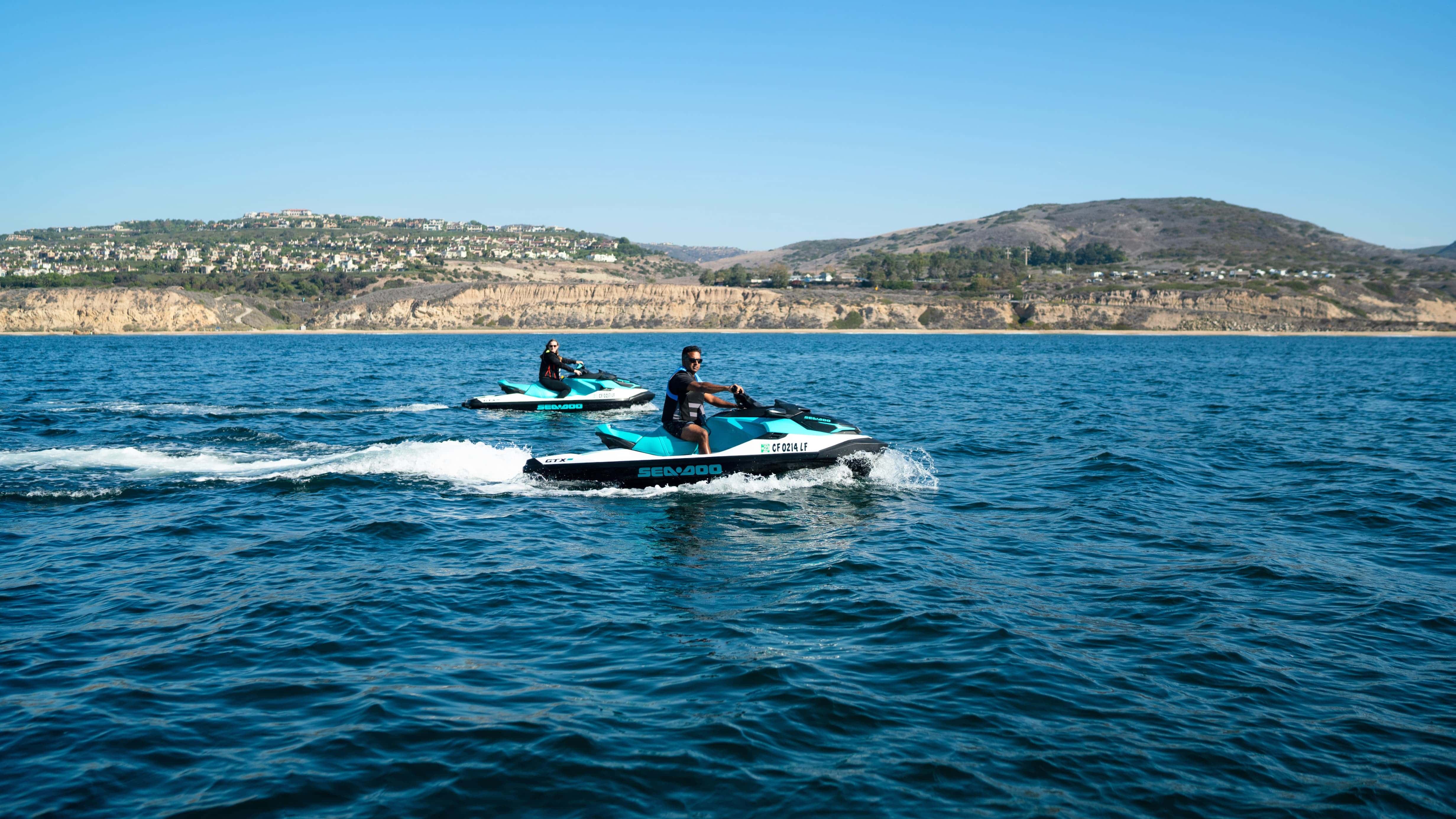 Two person riding a Sea-Doo on the californian coast