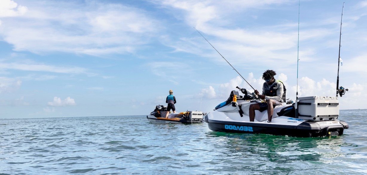 Two people fishing on their Sea-Doo FishPro personal watercraft