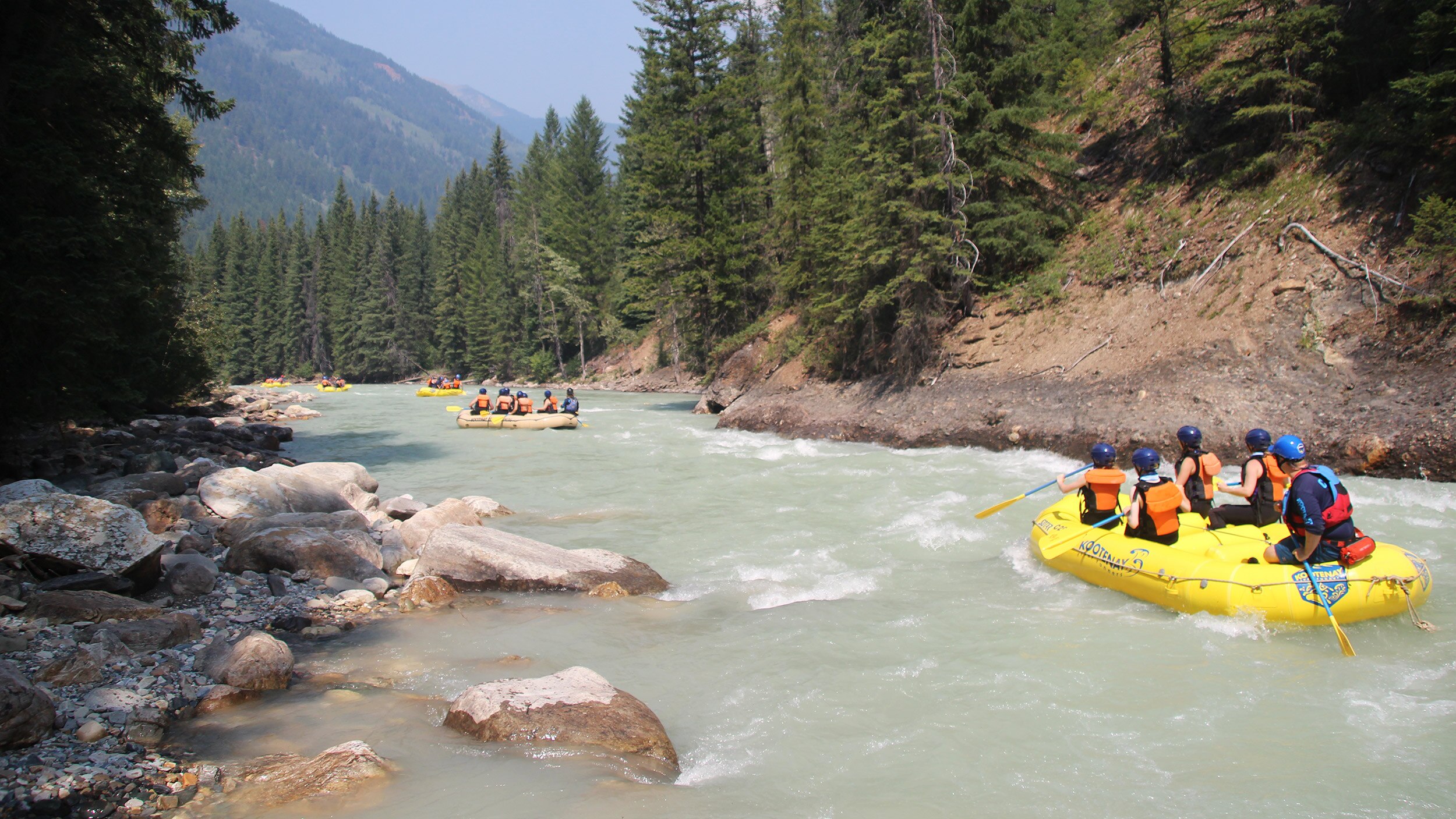 Groups of people rafting in a river